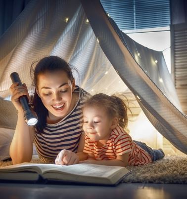 Mother and Child reading in a Tent